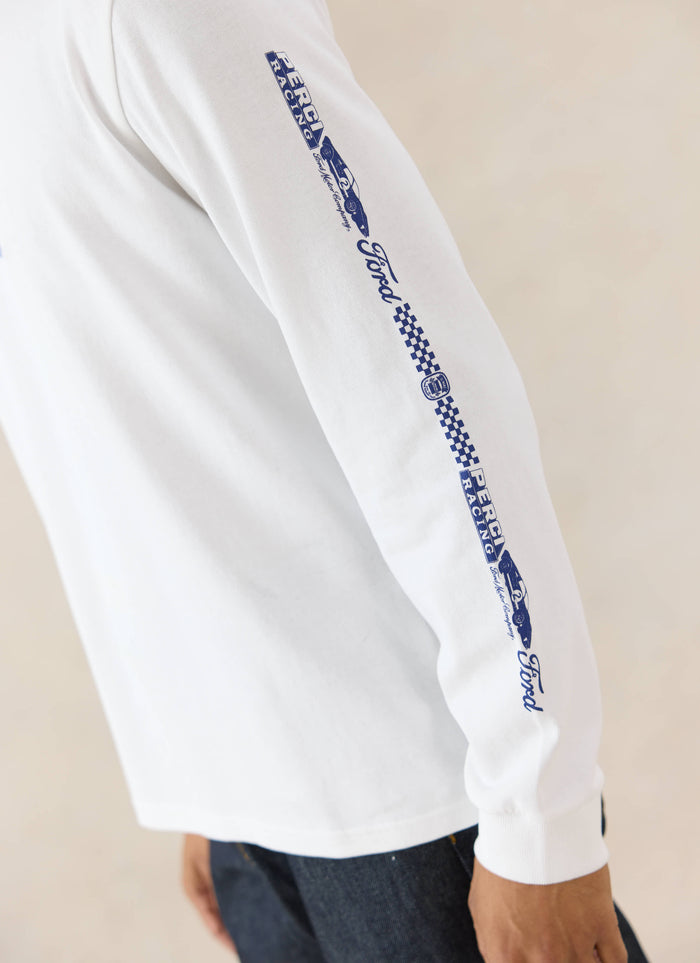 Close-up of the white Ford x Percival Triple Triumph long sleeve T-shirt sleeve, featuring blue vintage racing graphics.