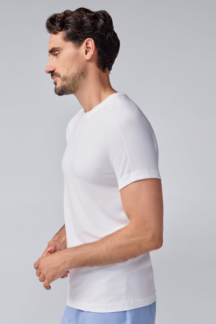 Side view of a man wearing 18-Hour Jersey Crew Neck Undershirt in Bright White