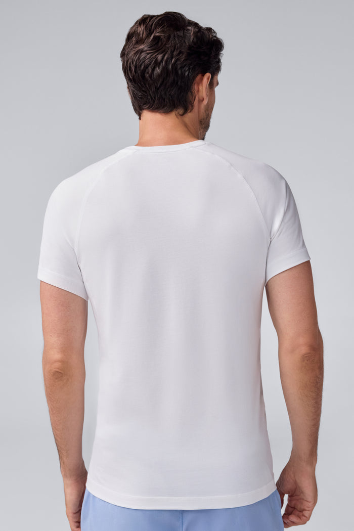Back view of a man wearing 18-Hour Jersey Crew Neck Undershirt in Bright White