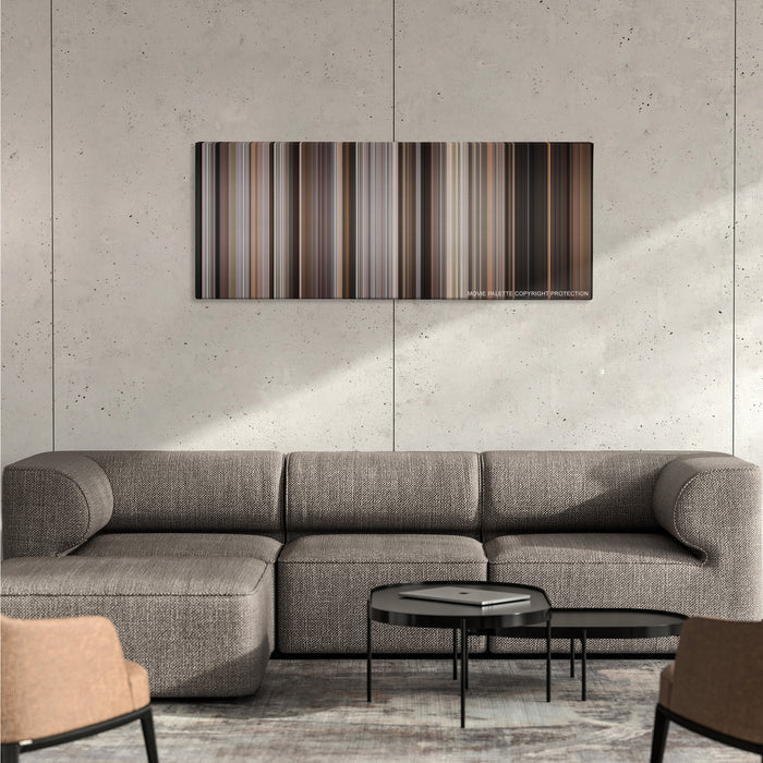 A Bronx Tale color palette canvas on a concrete wall above a gray sectional sofa