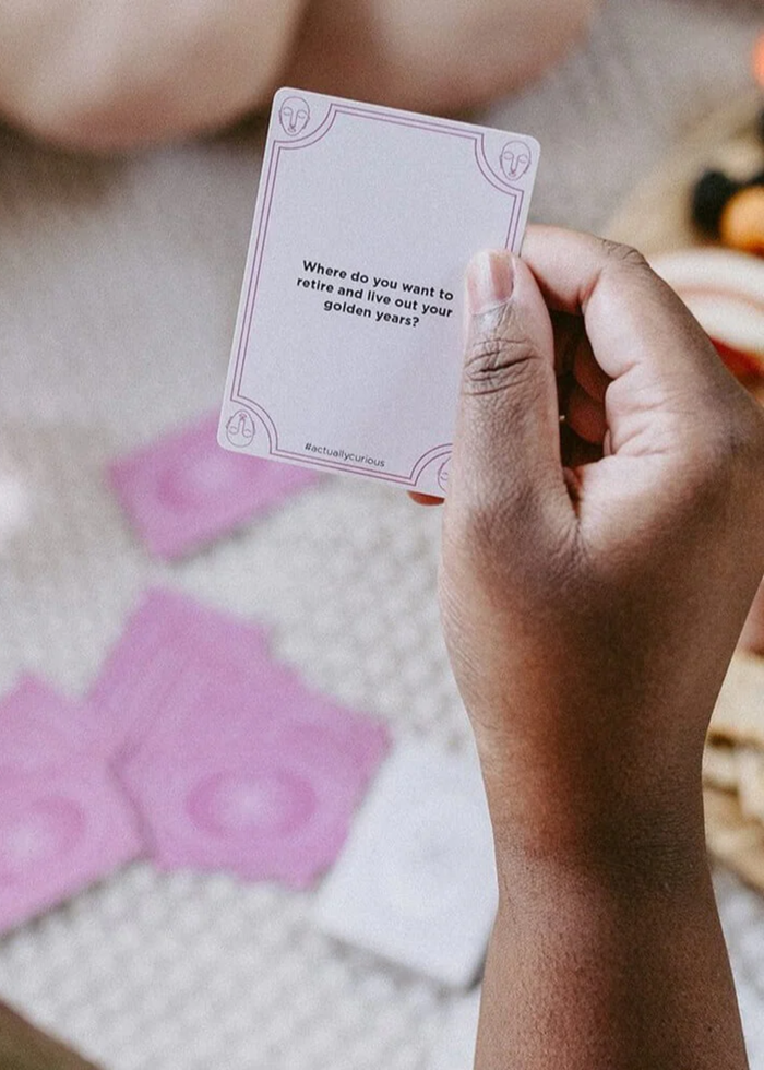 Person holding a card with a question on it