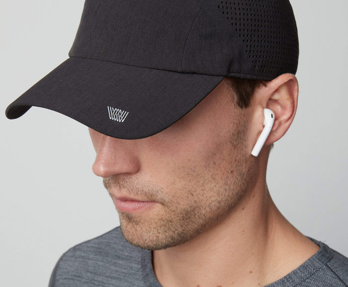 Front view of a man wearing AIRFLEX Hat in True Black