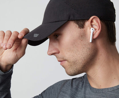 Side view of a man wearing AIRFLEX Hat in True Black