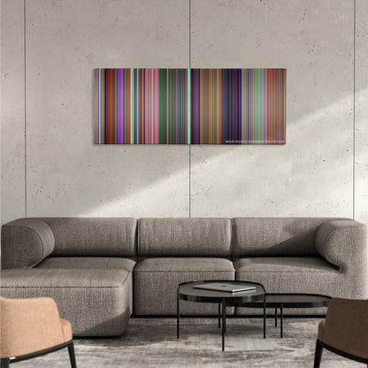 Alice in Wonderland color palette canvas on a concrete wall above a gray sectional sofa