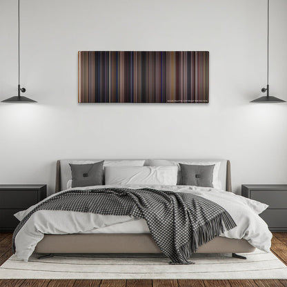 Almost Famous color palette canvas above a bed, between two black pendant lamps