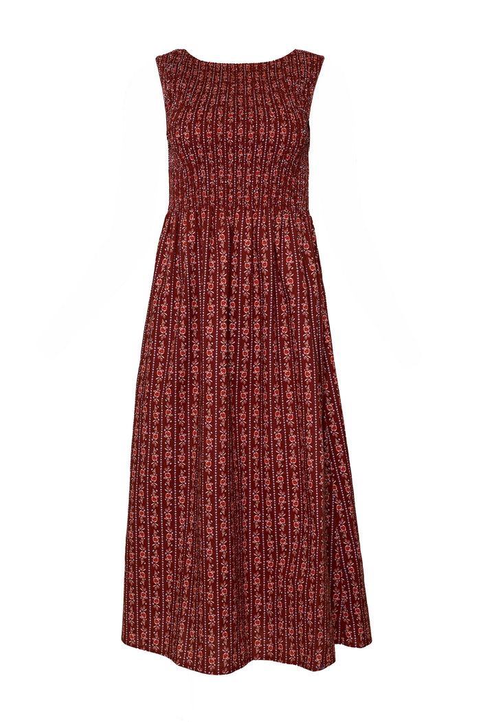 The Ana Dress in Sequoia Felicity Floral by Ivy City Co is a sleeveless, ankle-length maroon cotton dress with a round neckline and red-and-white floral print. Its smocked bodice and flared skirt offer a chic, maternity-friendly fit.