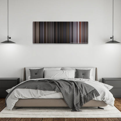 Ant-Man and the Wasp color palette canvas above a bed, between two black pendant lamps