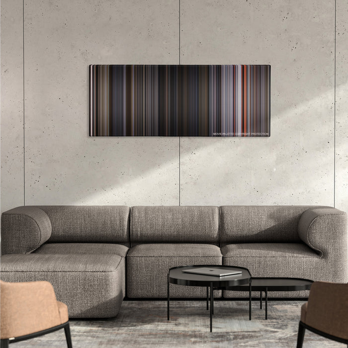 Ant-Man and the Wasp color palette canvas on a concrete wall above a gray sectional sofa