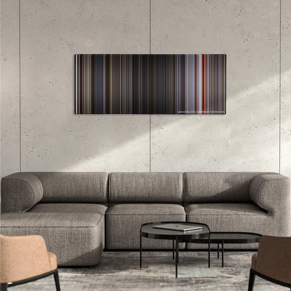 Ant-Man and the Wasp color palette canvas on a concrete wall above a gray sectional sofa