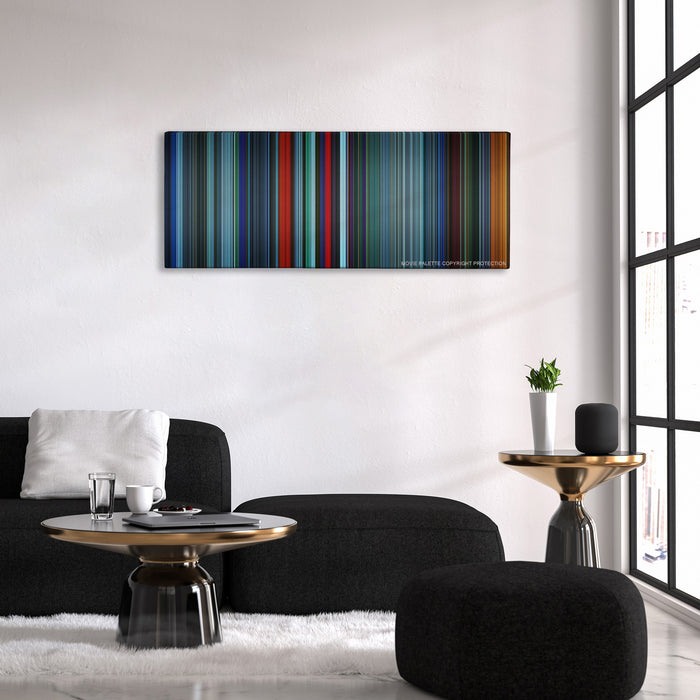Atomic Blonde color palette canvas above a black sofa with a gold-topped table