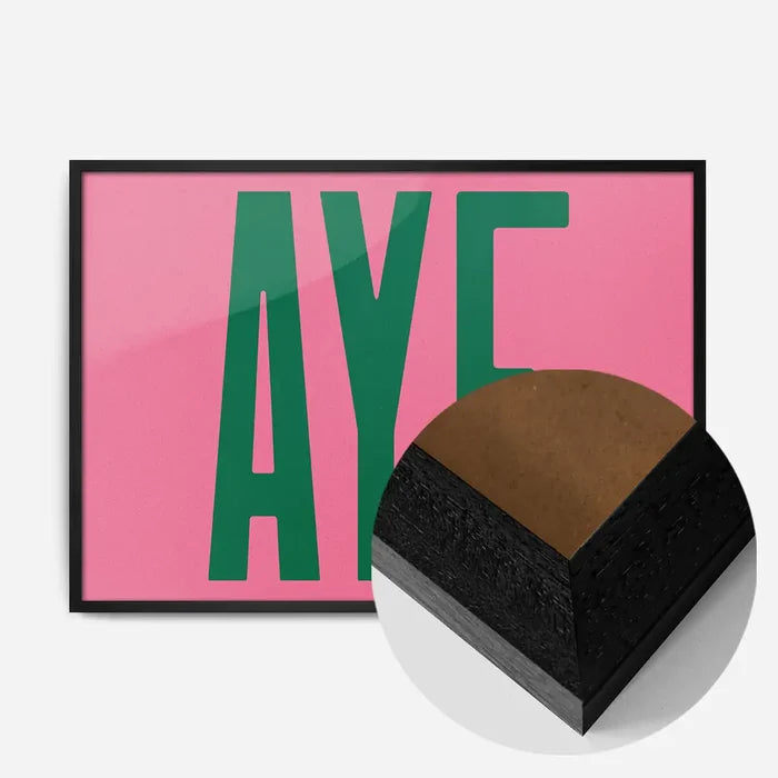 Aye Pink Typography Poster Print in a black wood frame