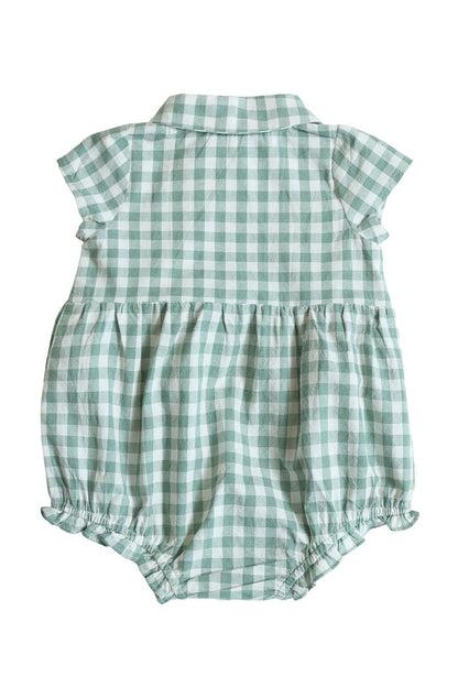 The Baby Amber Romper in Sage Gingham by Ivy City Co features a charming green and white checkered print, crafted from 100% cotton. Displayed flat with the back facing up, this romper includes short sleeves, a collar, a gathered waist, and elastic leg openings.