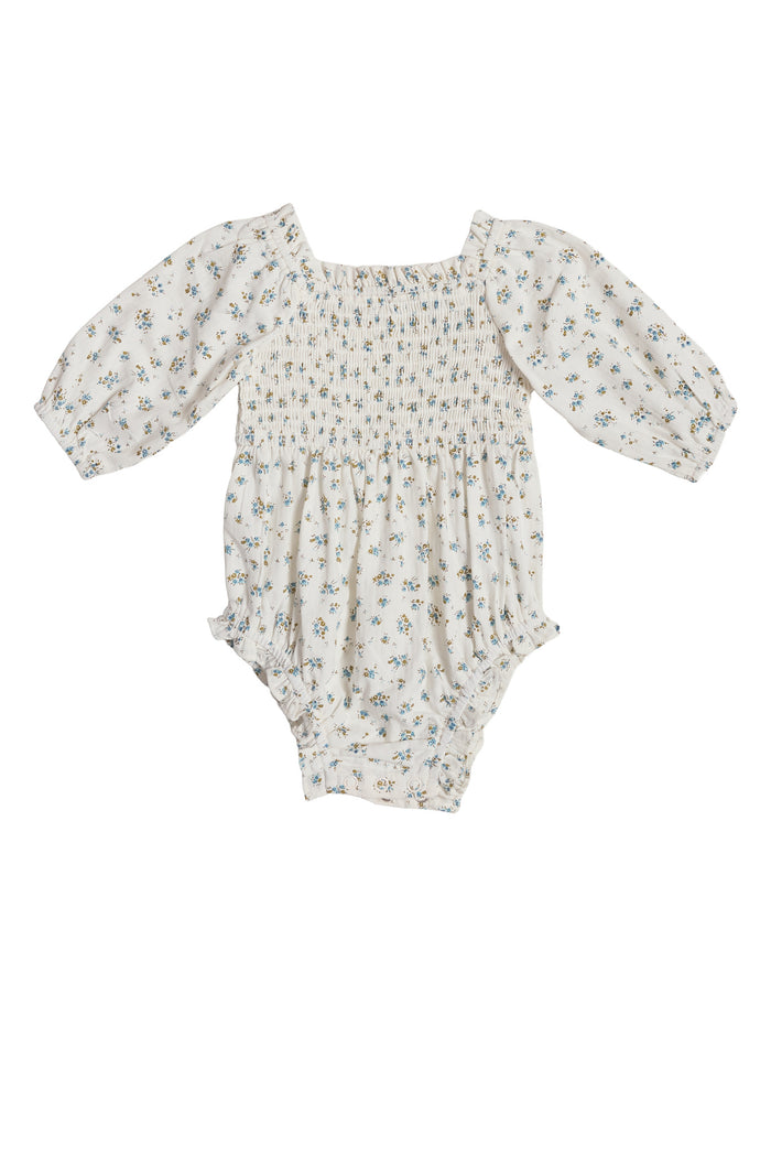 The Ivy City Co Baby Madeline Romper in Blue features long puffed sleeves, a square neckline, blue floral print, elastic leg openings, and crotch snaps—perfectly comfortable and ideal for your little one’s Easter outfit.