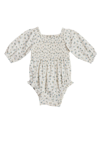 The Ivy City Co Baby Madeline Romper in Blue features long puffed sleeves, a square neckline, blue floral print, elastic leg openings, and crotch snaps—perfectly comfortable and ideal for your little one’s Easter outfit.