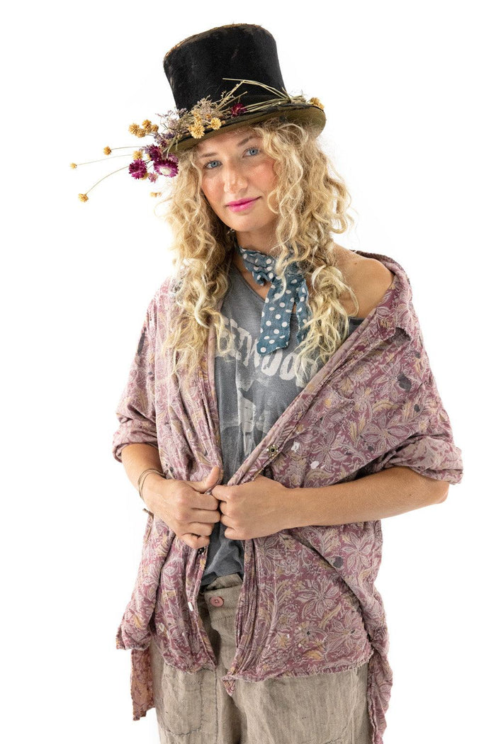 Woman in Magnolia Pearl vintage floral shirt, artisan top hat with flowers, whimsical style