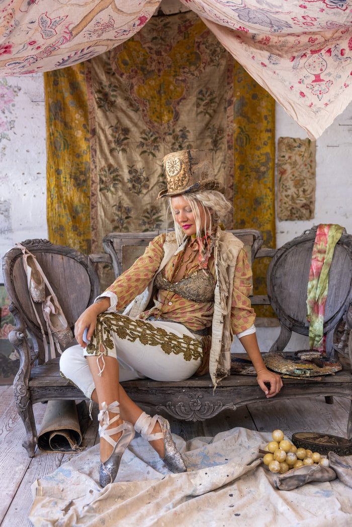 Woman in Magnolia Pearl artisan clothing and whimsical top hat, vintage decor, boho ballet style