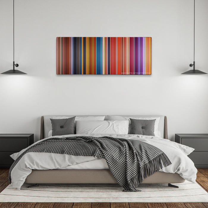 Brother Bear color palette canvas above a bed, between two black pendant lamps