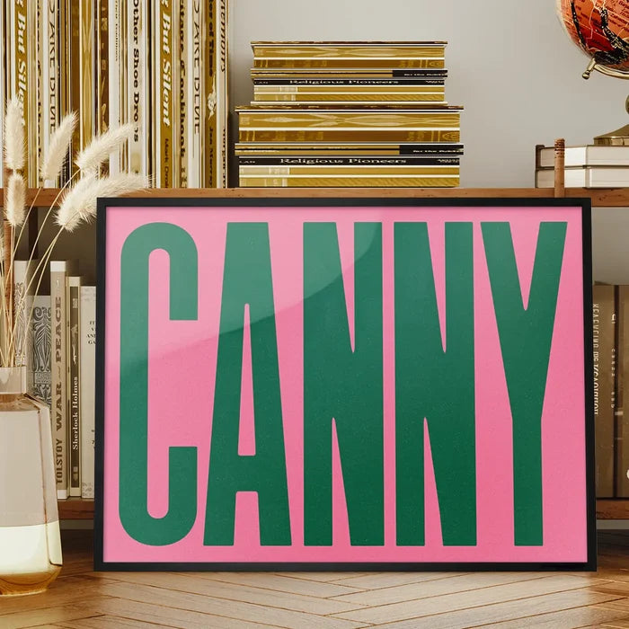 Canny Typography Poster Print framed on a living room bookshelf