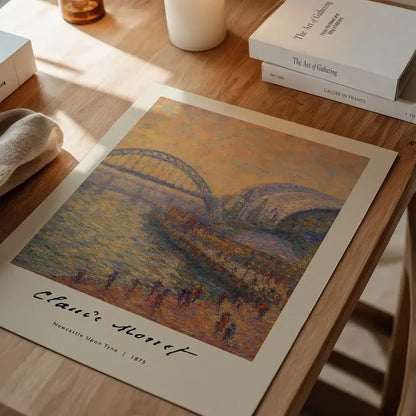 Claude Monet's Painting of Newcastle Quayside Print unframed on a home office desk