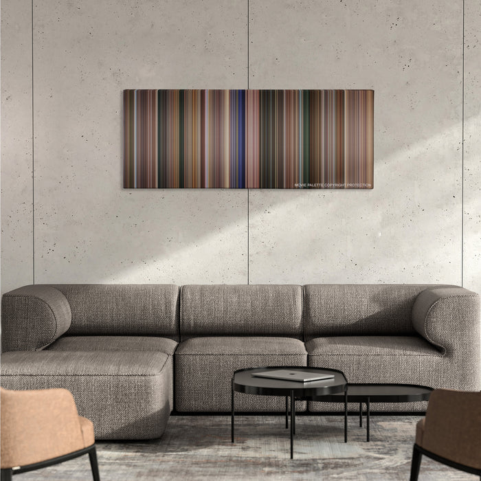 Coach Carter color palette canvas on a concrete wall above a gray sectional sofa