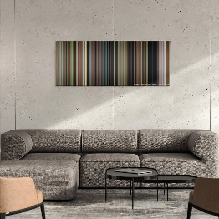 Enola Holmes color palette canvas on a concrete wall above a gray sectional sofa
