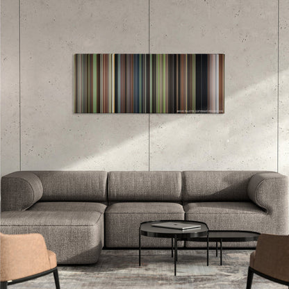 Enola Holmes color palette canvas on a concrete wall above a gray sectional sofa