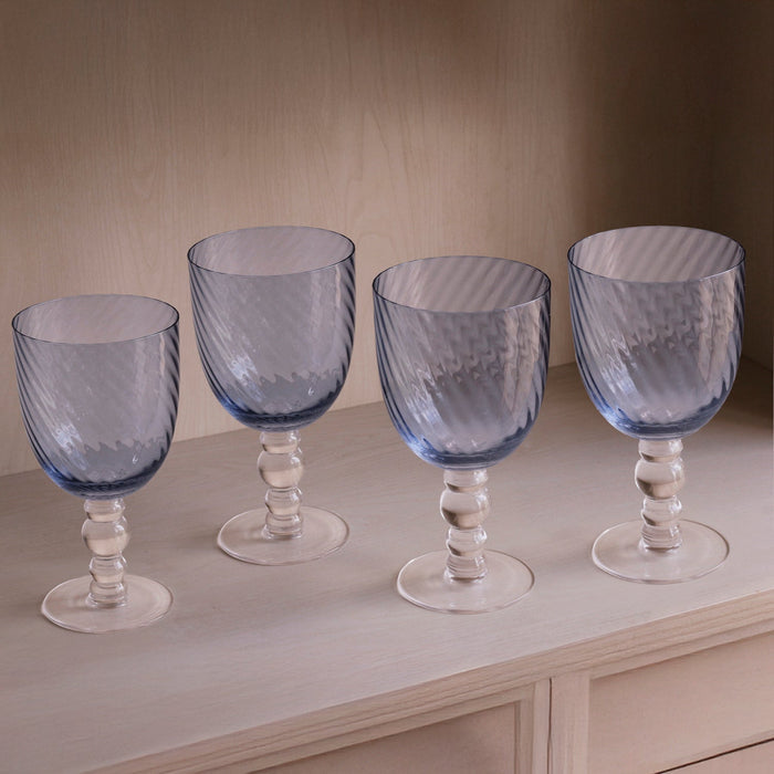 Beatriz Ball Glass French Swirl All Purpose — Four matching blue goblets on a shelf