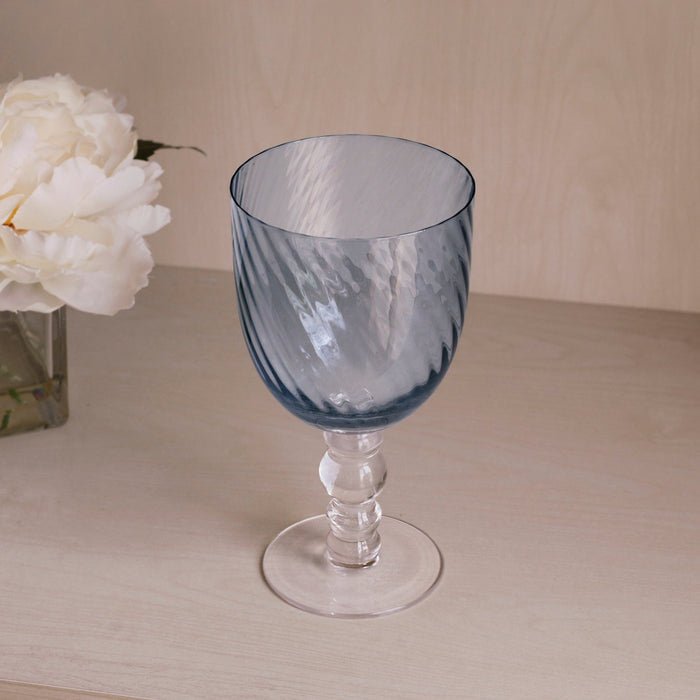 Beatriz Ball Glass French Swirl All Purpose — Single goblet beside white flowers