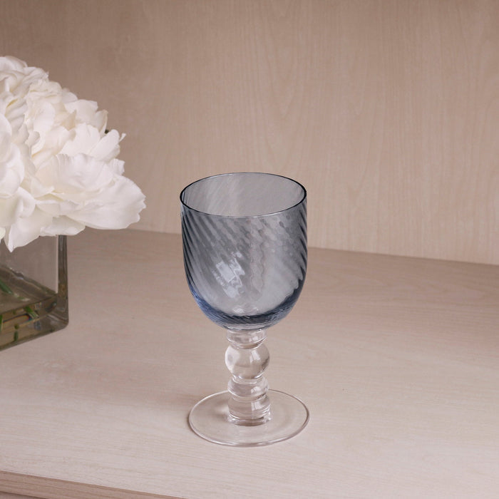 Beatriz Ball Glass French Swirl Wine — Single glass beside white flowers
