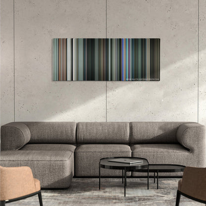 Gamer color palette canvas on a concrete wall above a gray sectional sofa