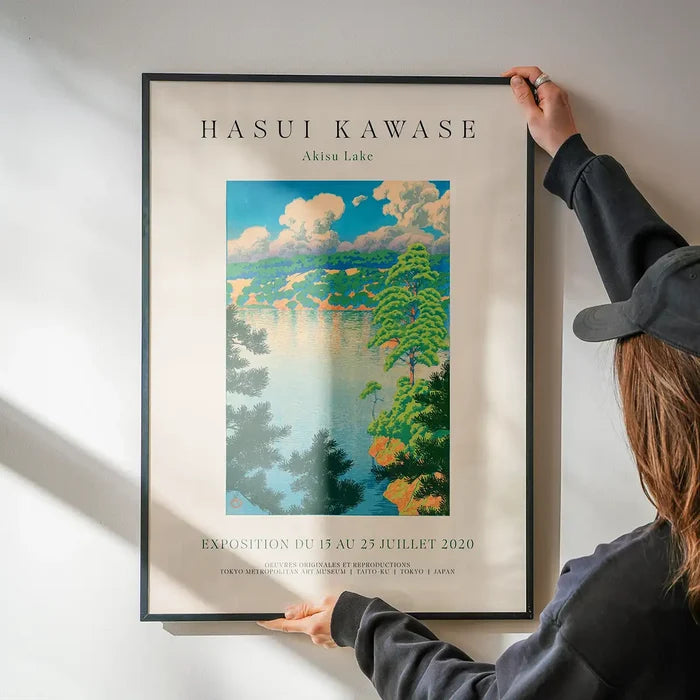 Hasui Kawase Akisu Lake Exhibition Poster Print being hung on a wall in a black frame