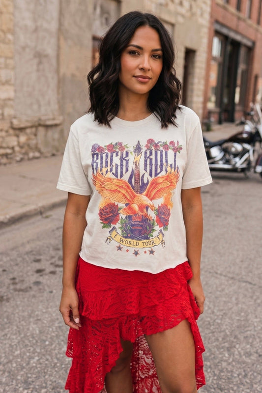 White faux crop graphic tee featuring a vintage Rock N Roll World Tour eagle graphic styled with a red lace skirt for a bold concert-ready look.