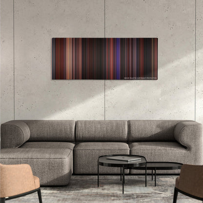 Hocus Pocus color palette canvas on a concrete wall above a gray sectional sofa