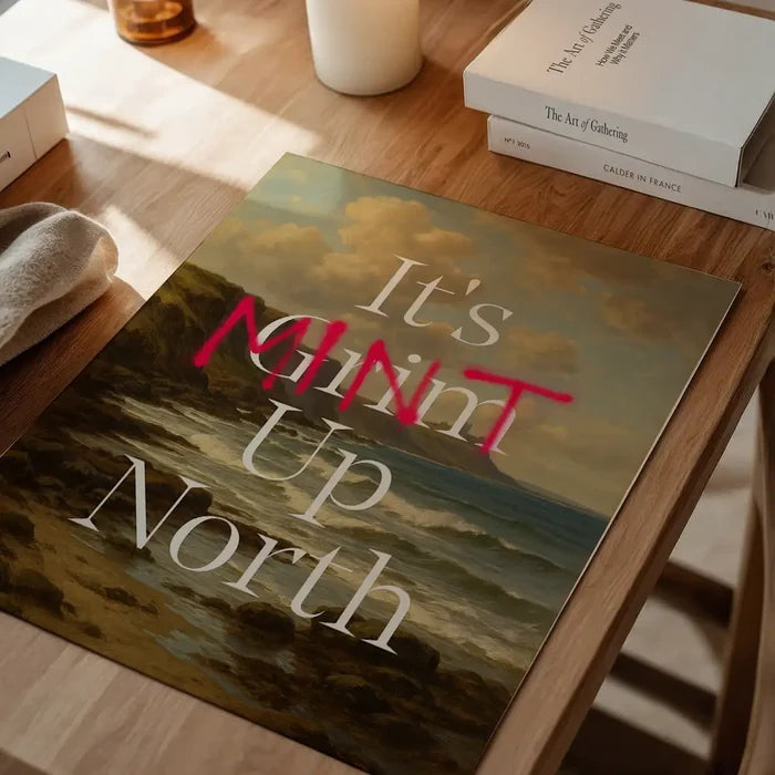 It's Mint Up North Typography Poster, quote print unframed on a home office desk