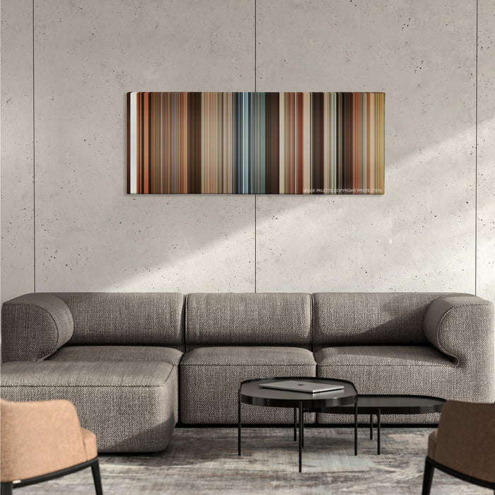Juno color palette canvas on a concrete wall above a gray sectional sofa