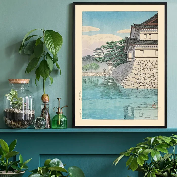 Kikyomon Gate Print by Hasui Kawase, Japanese woodblock print black framed on a living room shelf