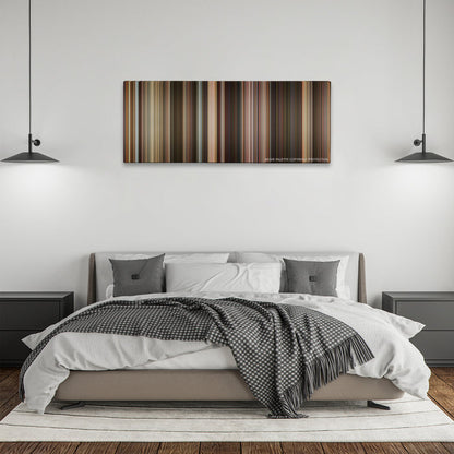 Last Vegas color palette canvas above a bed, between two black pendant lamps