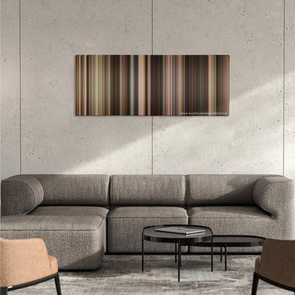Last Vegas color palette canvas on a concrete wall above a gray sectional sofa