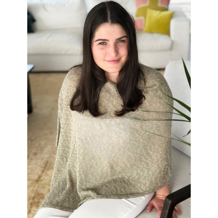 Woman wearing cotton poncho. Colour Stone