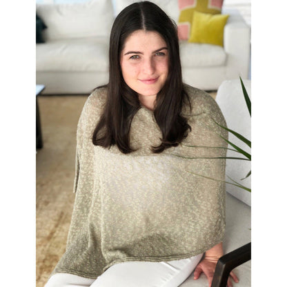 Woman wearing cotton poncho. Colour Stone