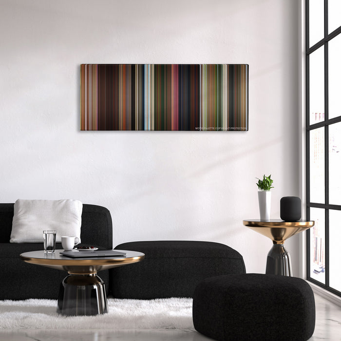 Madagascar color palette canvas above a black sofa with a gold-topped table