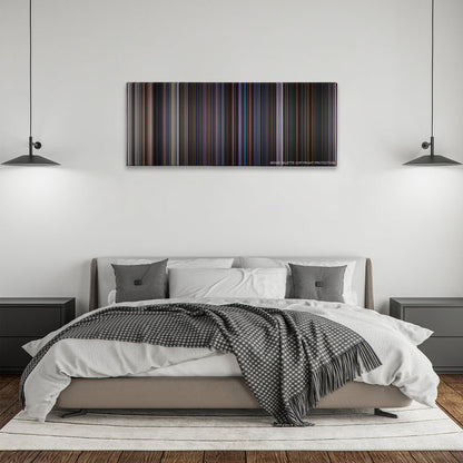 Magnolia color palette canvas above a bed, between two black pendant lamps