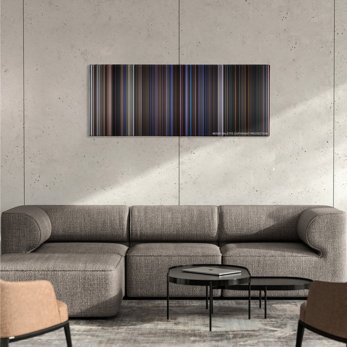 Magnolia color palette canvas on a concrete wall above a gray sectional sofa