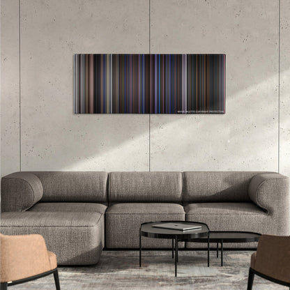 Magnolia color palette canvas on a concrete wall above a gray sectional sofa