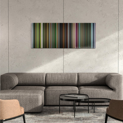 Oldboy color palette canvas on a concrete wall above a gray sectional sofa