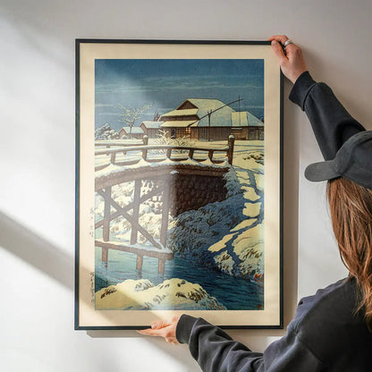 Ono in Mito Print by Hasui Kawase being hung on a wall in a black frame