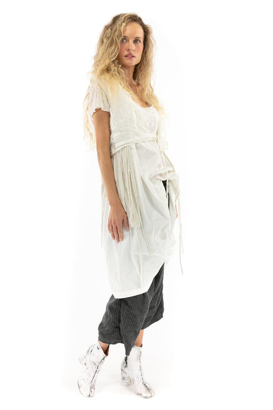 Woman wearing Magnolia Pearl vintage-style artisan tunic with whimsical layered white and gray design