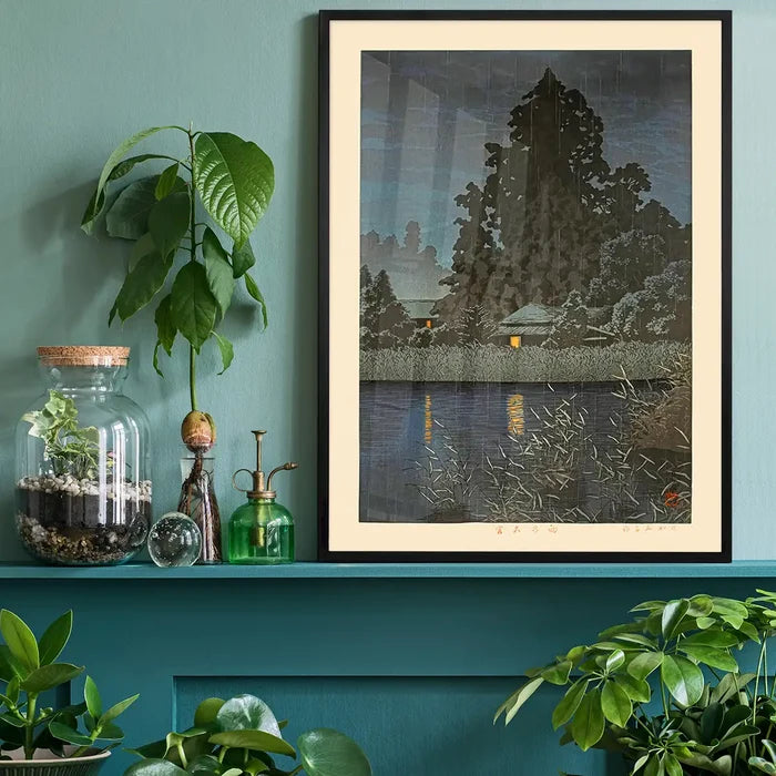 Rain at Omiya Print by Hasui Kawase, Japanese woodblock print black framed on a living room shelf