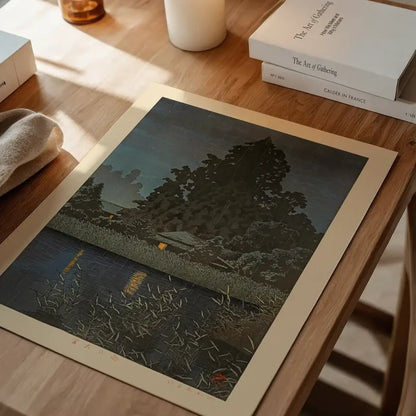 Rain at Omiya Print by Hasui Kawase, Japanese woodblock print unframed on a home office desk