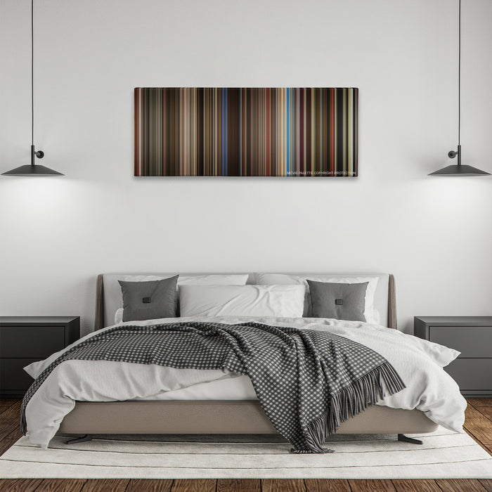 Rocketman color palette canvas above a bed, between two black pendant lamps